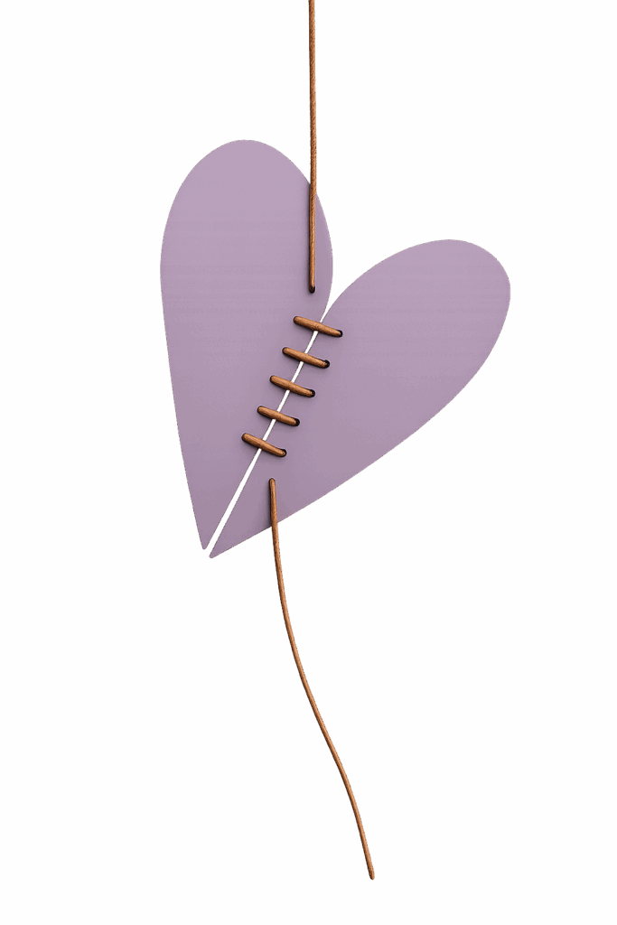 Cœur en papier raccommodé avec un fil cuivré, symbole de réparation émotionnelle et de thérapie relationnelle